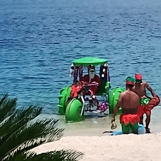 Santa shows up from the beach